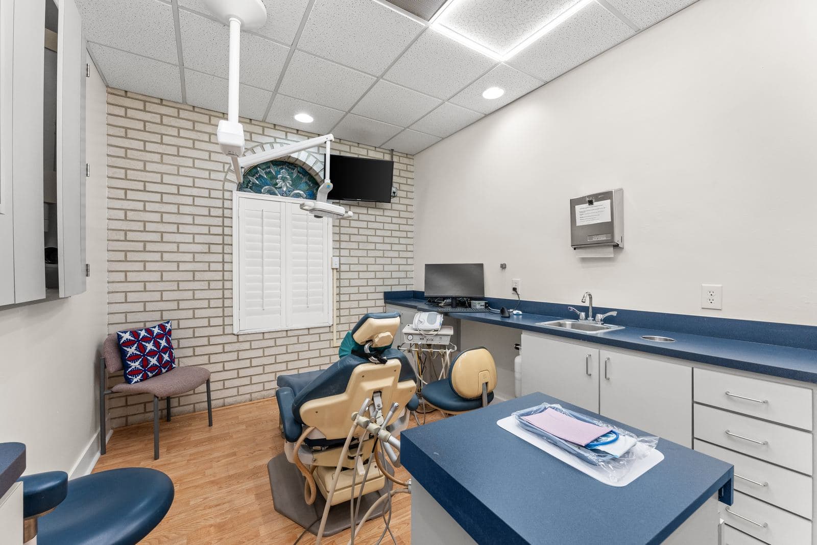 A treatment room at erth. dental with a dental chair and navy counters